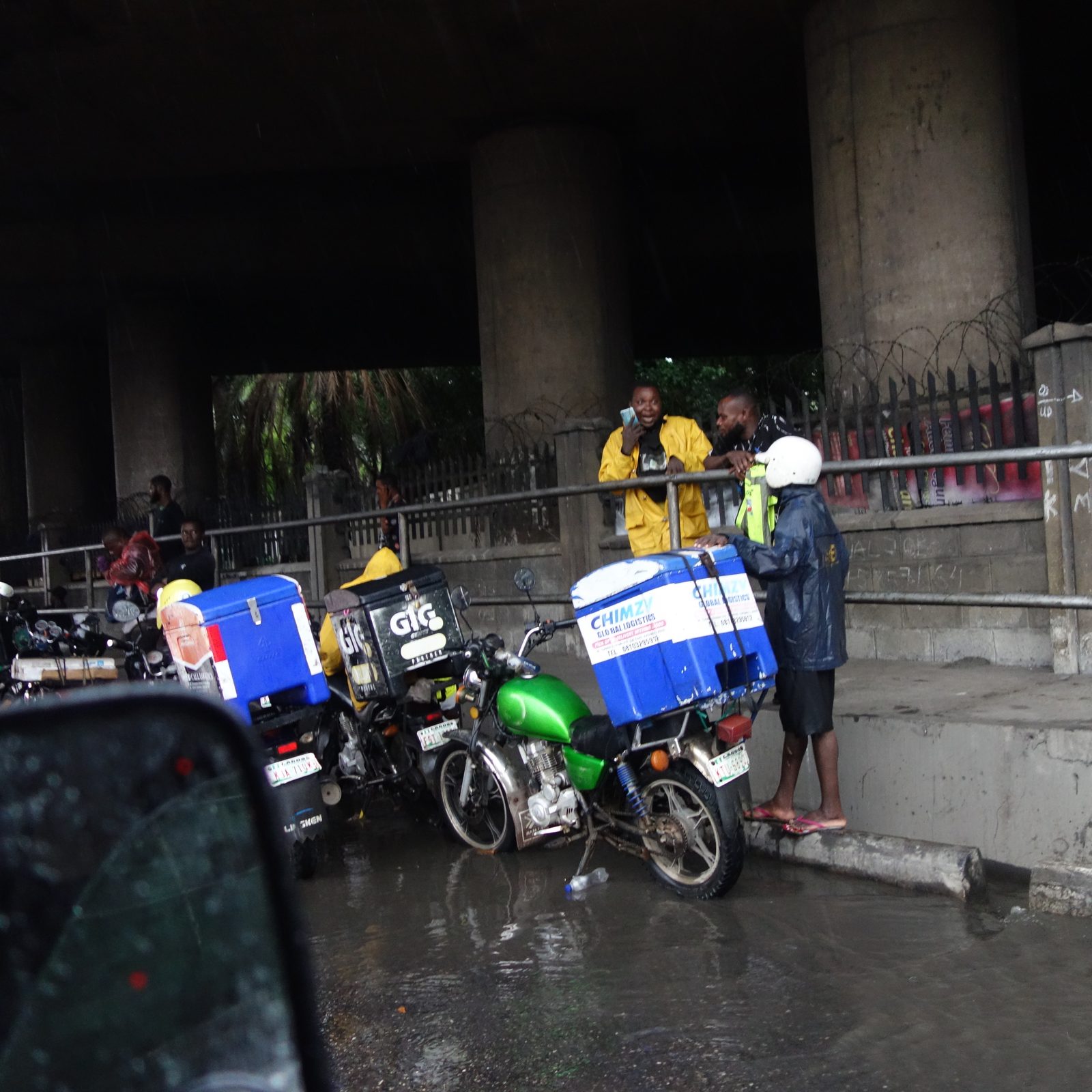 African courier team with delivery motorcycles